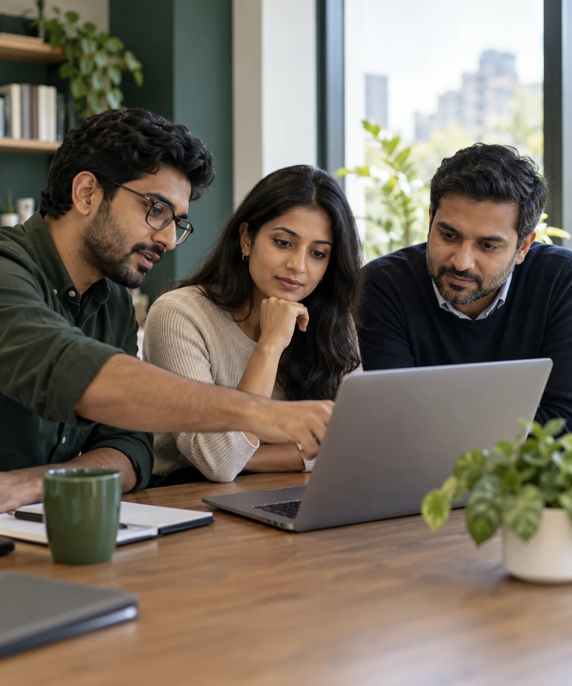 Illustrative scene of professionals collaborating around a laptop in a technology workspace